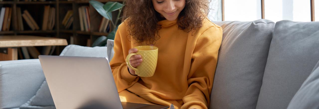 woman cozy at home on couch 