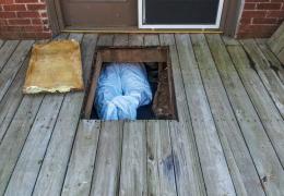 man in crawlspace