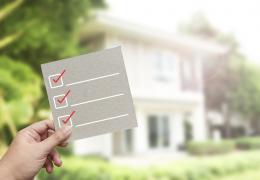 energy audit checklist concept, checklist in front of house exterior