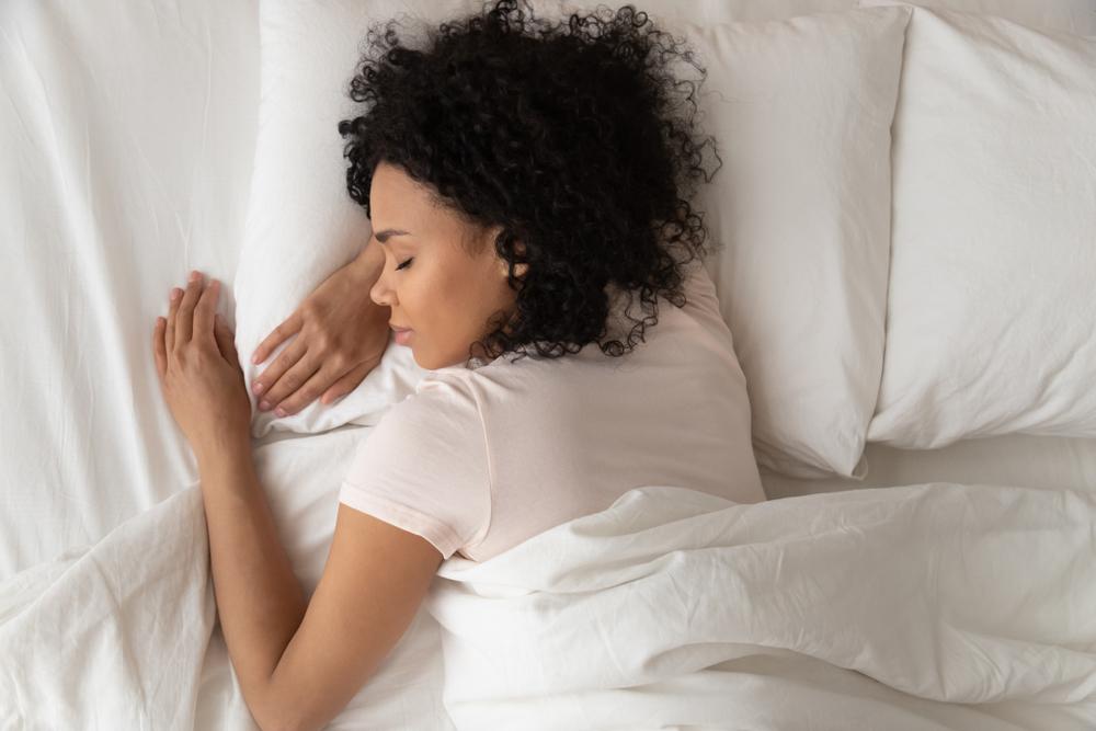 woman asleep in her bed at home